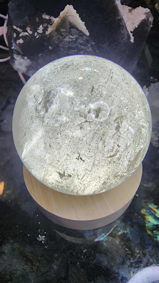 538g Clear Quartz Sphere with Rainbow and Specularite A145