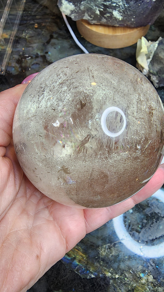 538g Clear Quartz Sphere with Rainbow and Specularite A145